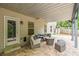 Covered patio with a comfortable seating area, perfect for outdoor relaxation and entertaining at 1529 Shiloh Manor Ct, Marietta, GA 30066