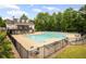 A community pool with lounge chairs and tables enhances the property's resort-style living experience at 1529 Shiloh Manor Ct, Marietta, GA 30066