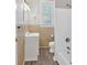 This cozy bathroom features a tub/shower combo and a light-colored tile wall at 345 Wellington Sw St, Atlanta, GA 30310