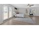 Bright bedroom features a ceiling fan, large windows and French doors to the outdoor patio at 345 Wellington Sw St, Atlanta, GA 30310