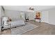 The primary bedroom features an area rug, a ceiling fan, artwork and great natural light at 345 Wellington Sw St, Atlanta, GA 30310