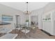 Bright dining area featuring an elegant chandelier and views of the living room and kitchen is perfect for entertaining at 345 Wellington Sw St, Atlanta, GA 30310