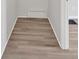 Hallway features attractive laminate floors and white trim throughout this home at 345 Wellington Sw St, Atlanta, GA 30310