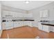 Spacious kitchen with white cabinets, black countertops, and ample counter space for cooking and entertaining at 345 Wellington Sw St, Atlanta, GA 30310