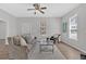 Bright living room featuring a couch, accent chair, and a decorative fireplace provides a comfortable gathering space at 345 Wellington Sw St, Atlanta, GA 30310