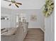 Inviting living room featuring gray walls, an open floor plan with views to the kitchen and dining area and hardwood floors at 345 Wellington Sw St, Atlanta, GA 30310