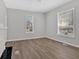 Living room with hardwood floors and two windows with plenty of natural light at 345 Wellington Sw St, Atlanta, GA 30310