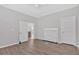 Living room with wood-look floors, fireplace, and open door to other areas of the home at 345 Wellington Sw St, Atlanta, GA 30310