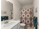 Bathroom featuring a vanity with a sink, a toilet, and a shower with patterned curtain at 5920 Hart Way, Cumming, GA 30028