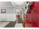 Inviting foyer with hardwood floors, wainscoting, and a view of the staircase at 5920 Hart Way, Cumming, GA 30028