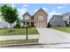 Charming two-story home featuring a covered porch and a well-maintained lawn at 5920 Hart Way, Cumming, GA 30028