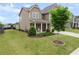 Charming two-story home featuring a covered porch and a well-maintained lawn at 5920 Hart Way, Cumming, GA 30028