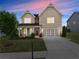 Charming two-story home featuring a covered porch and a well-maintained lawn at 5920 Hart Way, Cumming, GA 30028