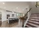 Modern kitchen featuring an island with seating, stainless steel appliances, and stylish finishes at 5920 Hart Way, Cumming, GA 30028