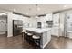 Well-equipped kitchen with a large center island, stainless appliances, and modern stylish cabinetry at 5920 Hart Way, Cumming, GA 30028