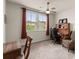 Cozy office with a large window, traditional wooden desk, and comfortable upholstered chair at 5920 Hart Way, Cumming, GA 30028