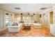 Finished basement with large sectional sofa, round table, and access to the backyard patio at 1285 Wesley Nw Pl, Atlanta, GA 30327