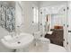 Bright bathroom featuring hexagon mirror, white tiling, and a view to the outdoors at 1285 Wesley Nw Pl, Atlanta, GA 30327