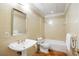 Well-lit bathroom featuring a pedestal sink, tiled shower, and classic fixtures at 1285 Wesley Nw Pl, Atlanta, GA 30327