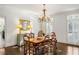 Bright dining room features hardwood floors, a chandelier, and beautiful trim work at 1285 Wesley Nw Pl, Atlanta, GA 30327