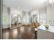 Bright dressing room featuring custom cabinets, mirrored doors, hardwood floors and natural light at 1285 Wesley Nw Pl, Atlanta, GA 30327