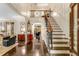 Elegant foyer boasts hardwood floors, a staircase, and high ceilings with classic trim work at 1285 Wesley Nw Pl, Atlanta, GA 30327
