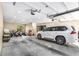 Well-lit garage featuring an SUV, motorcycles, and storage, offering ample parking and workspace at 1285 Wesley Nw Pl, Atlanta, GA 30327