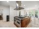 Large kitchen with island, stainless steel oven, stone floors and lots of cabinetry at 1285 Wesley Nw Pl, Atlanta, GA 30327
