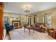 Spacious living room with a fireplace, wood floors, and large windows at 1285 Wesley Nw Pl, Atlanta, GA 30327