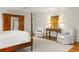 Well-lit main bedroom featuring hardwood floors, neutral-toned walls, and stylish furniture at 1285 Wesley Nw Pl, Atlanta, GA 30327
