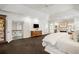 Generously sized main bedroom with fireplace, TV, and a view to the upper floor landing at 1285 Wesley Nw Pl, Atlanta, GA 30327