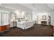 Expansive main bedroom boasting neutral decor, dual closets, and sitting area for relaxation and convenience at 1285 Wesley Nw Pl, Atlanta, GA 30327