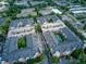 Stunning aerial view of the complex showcasing the pool and building layout with parking garages at 1850 Cotillion Dr # 4306, Dunwoody, GA 30338