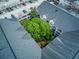 Unique aerial of courtyard surrounded by parking garage and buildings with gray shingles at 1850 Cotillion Dr # 4306, Dunwoody, GA 30338