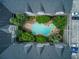 Overhead view of a courtyard with a swimming pool, surrounded by luxury condos and a parking deck at 1850 Cotillion Dr # 4306, Dunwoody, GA 30338