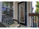 Relaxing balcony space with comfortable furniture and a view of the surrounding greenery at 1850 Cotillion Dr # 4306, Dunwoody, GA 30338