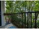Charming balcony featuring a dark metal railing with an idyllic green view at 1850 Cotillion Dr # 4306, Dunwoody, GA 30338