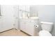 Compact bathroom featuring vanity, mirror, and toilet with neutral walls and tile flooring for easy maintenance at 1850 Cotillion Dr # 4306, Dunwoody, GA 30338