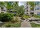 Beautiful courtyard view featuring mature trees, lush landscaping, and a serene water feature at 1850 Cotillion Dr # 4306, Dunwoody, GA 30338