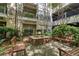 A community courtyard offers a tranquil escape with comfortable benches and a beautiful water feature at 1850 Cotillion Dr # 4306, Dunwoody, GA 30338