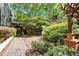 Beautiful condo courtyard featuring a brick-paved walkway and lush landscaping at 1850 Cotillion Dr # 4306, Dunwoody, GA 30338