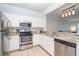 Bright kitchen with stainless steel appliances, granite countertops, and ample cabinet space at 1850 Cotillion Dr # 4306, Dunwoody, GA 30338