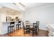 Open layout featuring a dining area and kitchen bar, offering a cohesive living space at 1850 Cotillion Dr # 4306, Dunwoody, GA 30338