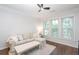 Cozy living room featuring hardwood floors, natural light, and comfortable seating at 1850 Cotillion Dr # 4306, Dunwoody, GA 30338
