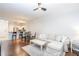 Inviting living room with hardwood floors and neutral decor connects to the kitchen and dining area at 1850 Cotillion Dr # 4306, Dunwoody, GA 30338