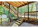 View of the backyard with steps leading to a deck, with a pool and storage shed in the background at 1900 Shady Creek Ln, Lawrenceville, GA 30043