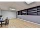 Finished basement with laminate floors, built in shelving, and recessed lighting at 1900 Shady Creek Ln, Lawrenceville, GA 30043