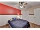 Bedroom featuring hardwood floors, a ceiling fan, and ample closet space at 1900 Shady Creek Ln, Lawrenceville, GA 30043