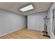 Bedroom with light wood floor, drop ceiling, closet with double doors, door with mirror, and clothes rack at 1900 Shady Creek Ln, Lawrenceville, GA 30043
