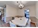Formal dining room with a chandelier and seating for six at 1900 Shady Creek Ln, Lawrenceville, GA 30043